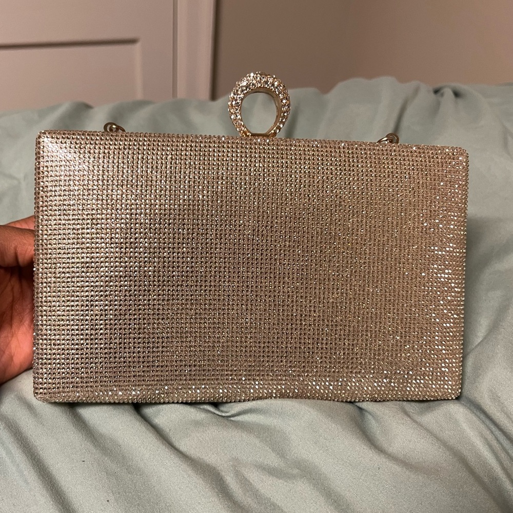 Rhinestone gold clutch purse. With attachable strap.